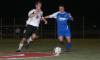Senior Duncan Nicol goes for a steal against a Lindsey Wilson opponent. - Photo by Stephanie Schroeder