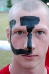 Mike Evans shows off his school spirit by getting a giant U painted on his face for the pep rally and march to the soccer game. - Photo by Kyle Kurlick