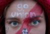 Natalie Newberry decks herself out in Union colors and paints her face to show her support for the soccer team. - Photo by Kyle Kurlick