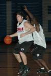 Junior Ryan Merriman and Freshman Kennedy Okello battle during practice in preparation for thie season-opener versus Olivet Nazarene. - Photo by Holly Gushee