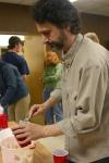 Tim Lowly, a guest artist from Chicago, serves himself ice cream for dessert during the art retreat. - Photo by Stephanie Schroeder