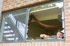 Union graduate Davie Moore volunteered his time to help clean up and restore windows in buildings on
campus that had suffered tornado damage. - Photo by Justin Veneman