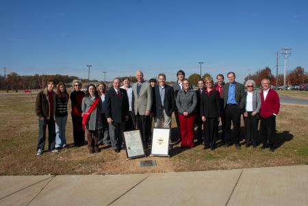 People who attended the time capsule dedication ceremony of the Delta-Psi Chapter of Phi Alpha Theta gathered around the time capsule after the program, which took place during Homecoming 2006.  