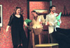 Lindsey Garner welcomes the Spanish brothers played by Ryan Schunemann (Jesus) and Jeremy Young (Manolo) in <i>The Odd Couple.</i> - Photo by Jim Veneman