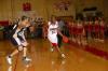 Senior Mack Bealim (32) dribbles the ball down the court during Saturday's Homecoming game versus Olivet Nazarene University (Ill.). - Photo by Morris Abernathy