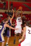 Pierry Valmera (44), Senior center, shoots for 2 of his 22 points versus Olivet Nazarene University (Ill.). - Photo by Morris Abernathy