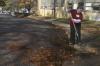 Freshman Sara Beth Woodbury helps out at Alexander Magnet Elementary School by raking tons of leaves on the school property during Day of Remembrance. - Photo by Stephanie Schroeder