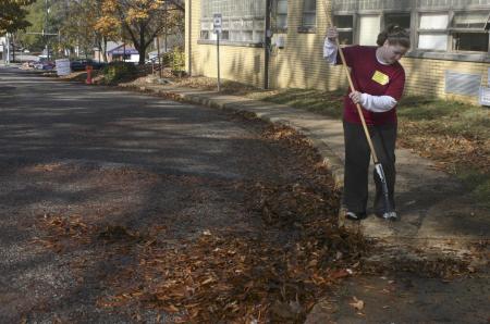 Freshman Sara Beth Woodbury helps out at Alexander Magnet Elementary School by raking tons of leaves on the school property during Day of Remembrance.
