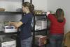 Junior Christina Pool and Sophomore Anna Townsend organize a once messy storage room for Iglesia Bautista Hispania Church located at Poplar Heights Baptist Church during Day of Remembrance. - Photo by Stephanie Schroeder