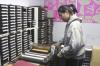 Freshman Lyda Kim uses an accu-cut board to make paper cut-outs of animals in order to decorate one of the classrooms at Iglesia Bautista Hispania Church located at Poplar Heights Baptist Church during Day of Remembrance. - Photo by Stephanie Schroeder