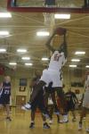 Sophomore Josephine Owino grabs a rebound during the Homecoming game against St. Gregory's University, Okla. - Photo by Stephanie Schroeder
