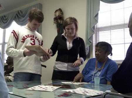 When Ethel Jones called bingo, GO Thailand teammates Matt Taylor and Amy Brown came to check her board at Mission Convalescent Home during Day of Remembrance. 