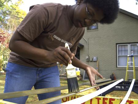 The window wedges at the Young Life house needed painting and who better to do it than SAC President Jande Jackson on Day of Remembrance. 
