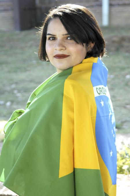 Sophomore Ana Paula Epifanio, Spanish major, wears the flag of her native country of Brazil. Epifanio is the public relations represenative for the newly resurrected International Student Organization which seeks to &ldquo;provide the resource or channel for the outside community to receive information, knowledge and awareness of international cultures.&rdquo;