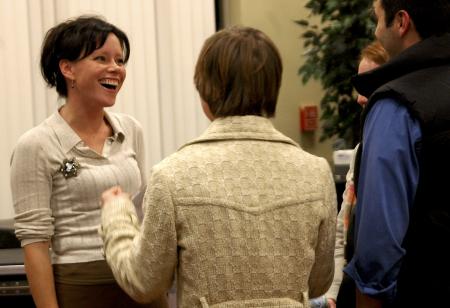 Christian recording artist Sara Groves chats with Alum Jill Zimmer and Senior Drew Zimmer, Christian ethics major, after the 2006 Homecoming Coffee House. 