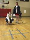 Lauren Norton watches as Jenny Emanuel plays a tic-tac-toe game at the carnival during Frost Fest put on by SAC. - Photo by Stephanie Schroeder
