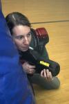 Kasey Cobb guards herself and looks for ways to gain points during a laser tag game held in the small gym during Frost Fest put on by SAC. - Photo by Stephanie Schroeder