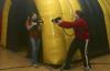 Rachel Daniel and Hunner Coward shoot each other in a laser tag game held in the small gym during Frost Fest put on by SAC. - Photo by Stephanie Schroeder