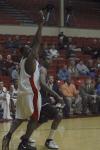 Senior Pierry Valmera uses his height to guard a Mountain State University player. - Photo by Holly Gushee