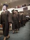 Michelle Lawrence, English graduate, and Nang Mitsamphanh, public relations/advertising graduate, enter the worship center at West Jackson for Union's fall graduation. - Photo by Kyle Kurlick