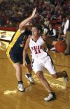 Lady Bulldog Kaitlin Dudley breaks through the defense of Blue Mountain College, Miss. - Photo by Matthew Diggs