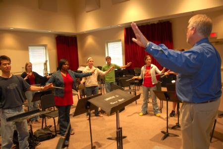 David McClune, university professor of music, leads a conducting class.