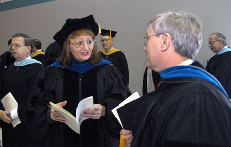 Biology faculty members Carol Weaver and James Huggins prepare for Union's December graduation ceremony.