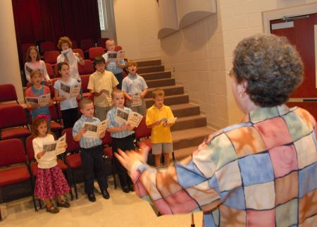 Betty Bedsole, professor of music, works with the Children's Choir.