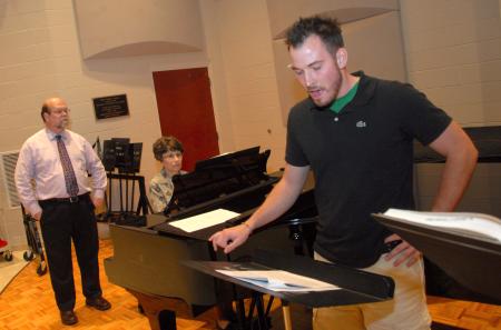 Mike Penny (left), professor of music, works with Austin Clark during an Opera Workshop rehearsal.  Mrs. Joan Forbes is the accompanist.