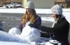 Junior Sarah Nadaskay (right), english major, and Senior Emily Hurst (left), learning foundations major, build snow men on cars. - Photo by Matthew Diggs