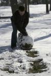 Scott Harden used the little bit of snow that came to campus to build a snow man.  Many students around campus built their own versions of snow men during the school's snow day. - Photo by Stephanie Schroeder