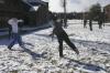 The men of McAfee formed alliances to stage a snow ball fight in the McAfee courtyard during the snow day on  campus. - Photo by Stephanie Schroeder