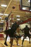Deywane Lee jumps over Trevecca Nazarene University opponents as he shoots and scores. - Photo by Stephanie Schroeder