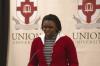 Alum Phylis Anyango read a selction about Nelson Mandela during the First Annual Black History Month Program. - Photo by Wayne Holmes