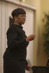 Patricia Porter, transfer coordinator, lead a spirited version of <em>Kum Ba Yah</em> during the First Annual Black History Month Program. - Photo by Wayne Holmes