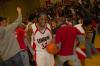 Mack Bealim (32) celebrates with his teammates and the fans after the OT victory over Lambuth in the semi-final game of the TranSouth Tournament. - Photo by Morris Abernathy