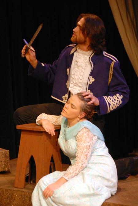David Longobardo as Antonio talks of the murder of the sleeping Julie Palmer as Alisha in the theatre's production of <em>The Tempest</em>.