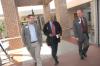 Tim Ellsworth (left) and Mark Kahler (right) of university communications chat with Juan Williams en route to the Union Forum. - Photo by Morris Abernathy