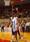 Josephine Owino takes a shot under the basket during the first round game of the NAIA National Tournament. - Photo by Morris Abernathy