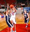 Freshman Kaitlin Dudley fights to make a shot against The Master's College during the first round of the NAIA National Tournament. - Photo by Morris Abernathy