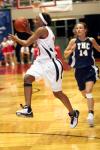 Lady Bulldog Ena Daniels passes the ball off to a teammate in the first half of the game against The Master's College in the first round of the 2007 NAIA Championship Tournament. - Photo by Kyle Kurlick