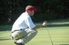 Gary Glapa eyes the lay of the green prior to one of his puts at the Union Invitational at Falcon Ridge Golf Club. - Photo by Morris Abernathy