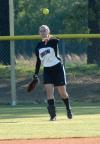 Michelle Albonetti throws the ball back to the infield after a catch in right field. - Photo by Steven Aldridge