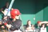 Heidi Bybee stands ready to hit with her teammates watching from the dugout. - Photo by Steven Aldridge