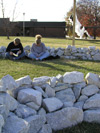 Chris Bruno of Memphis and Lori Neal of Paris, Tenn. participate in a 24-hour prayer chain at the altar constructed by the art department in the middle of the environmental installation that stretches from 45 Bypass to Pleasant Plains Extended. - Photo by Cam Tracy