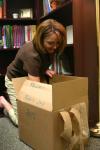 Christie Pawley, instructor of nursing, unpacks the last of her boxes in her new office in White Hall. - Photo by Stephanie Schroeder