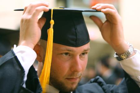 Physical Education and Health graduate Clint Arthur adjusts his cap moments before heading out to the Great Lawn for the spring 2007 graduation ceremony.