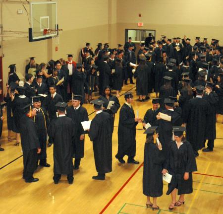 Graduates gathered in the small gym waiting to line up for the processional to the spring 2007 graduation ceremony.