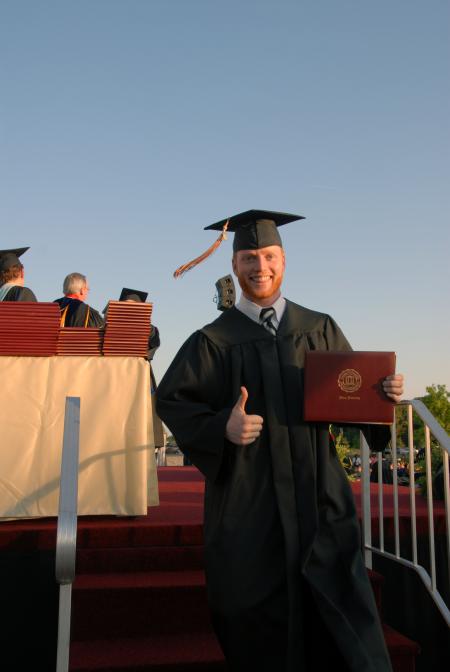 Business Administration graduate Jack Smothers celebrates after receiving his diploma at the spring 2007 graduation ceremony.
