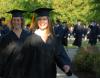 Social Work graduates Elisabeth Berry and Leah Booth file onto the Great Lawn for the spring 2007 graduation. - Photo by Morris Abernathy